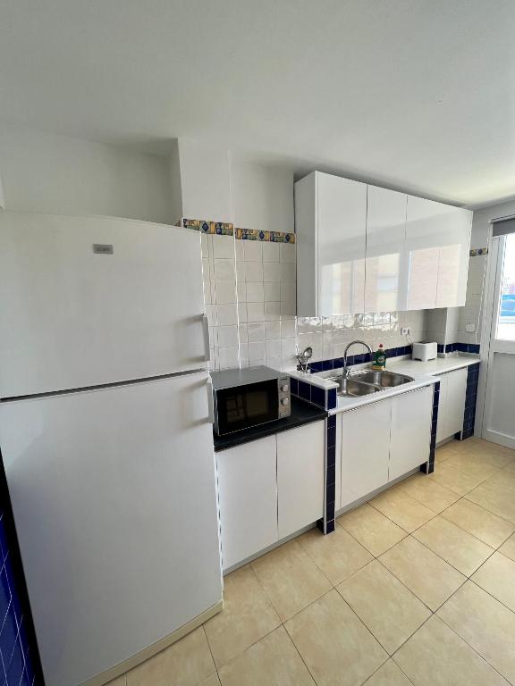 Kuchyňa alebo kuchynka v ubytovaní Apartamentos Prestige Suites Málaga II