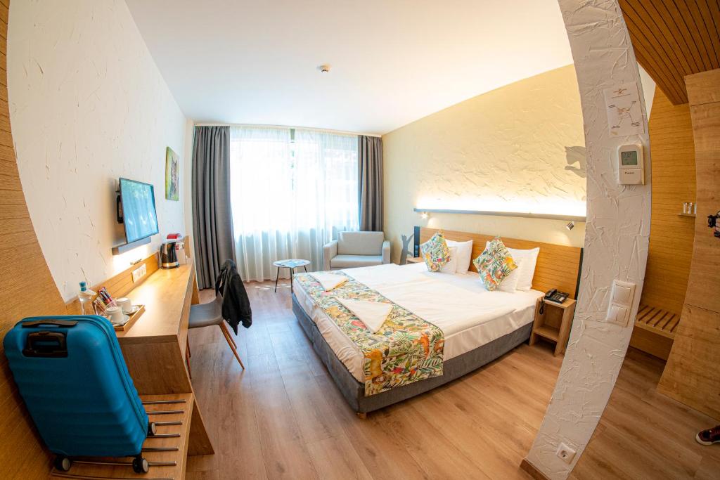 Łóżko lub łóżka w pokoju w obiekcie Pangea Hotel