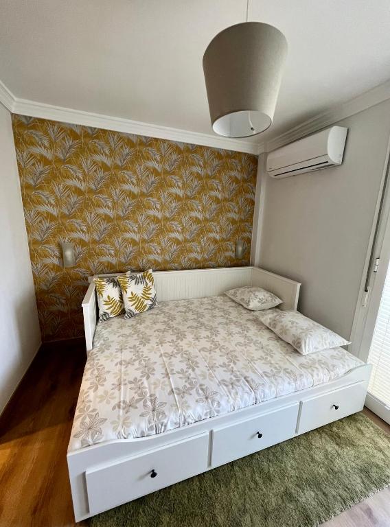 Posteľ alebo postele v izbe v ubytovaní Apartamentos Prestige Suites Málaga II