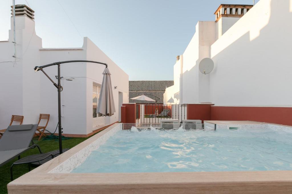 a swimming pool on the roof of a building at Green-Apartments Pleno Centro in Seville