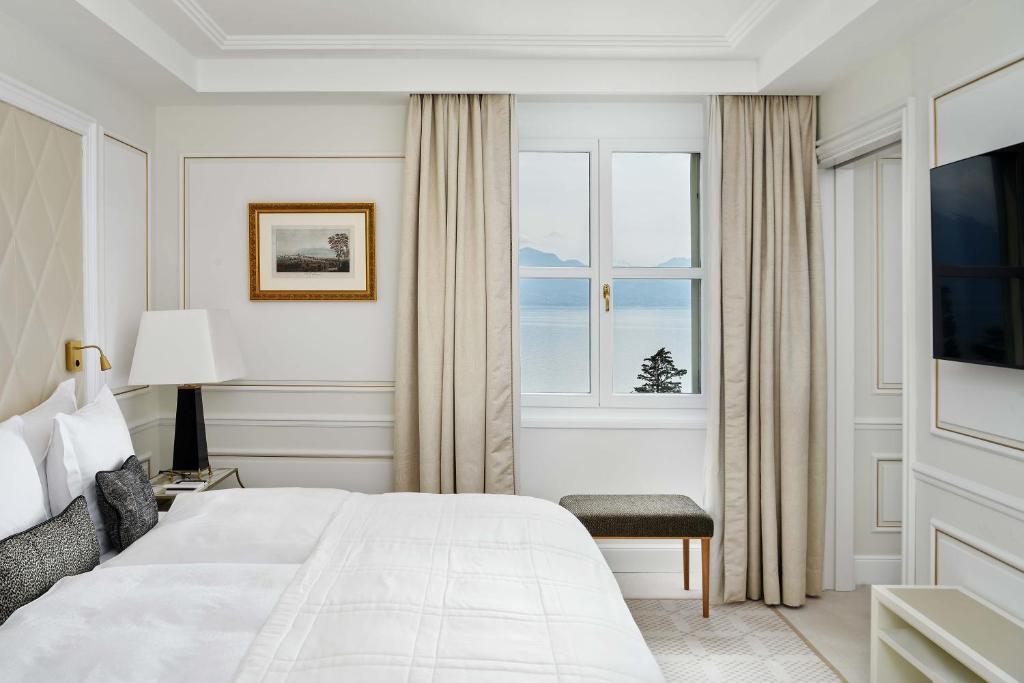Postel nebo postele na pokoji v ubytování Beau-Rivage Palace