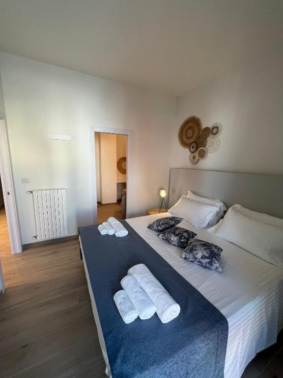 Postel nebo postele na pokoji v ubytování Appartamenti Savelletri Via del Porto