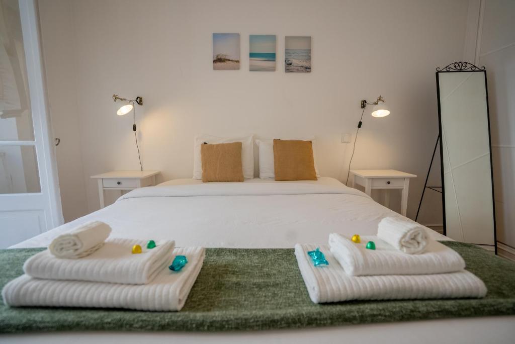 Postel nebo postele na pokoji v ubytování The Av. Roma Apartment