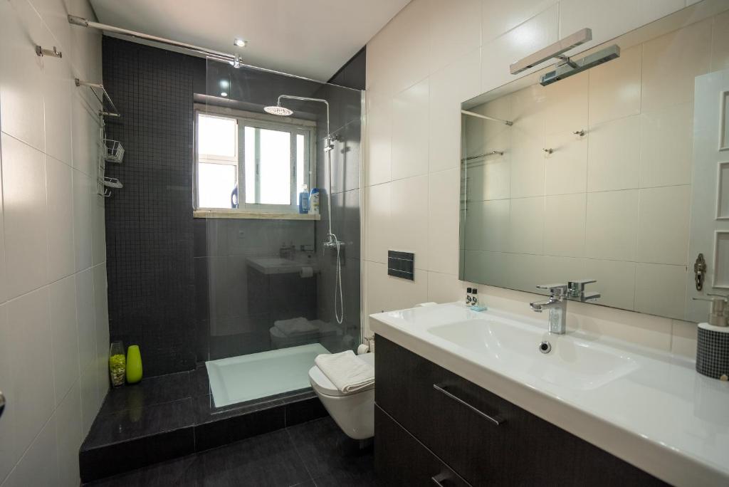 Koupelna v ubytování The Av. Roma Apartment