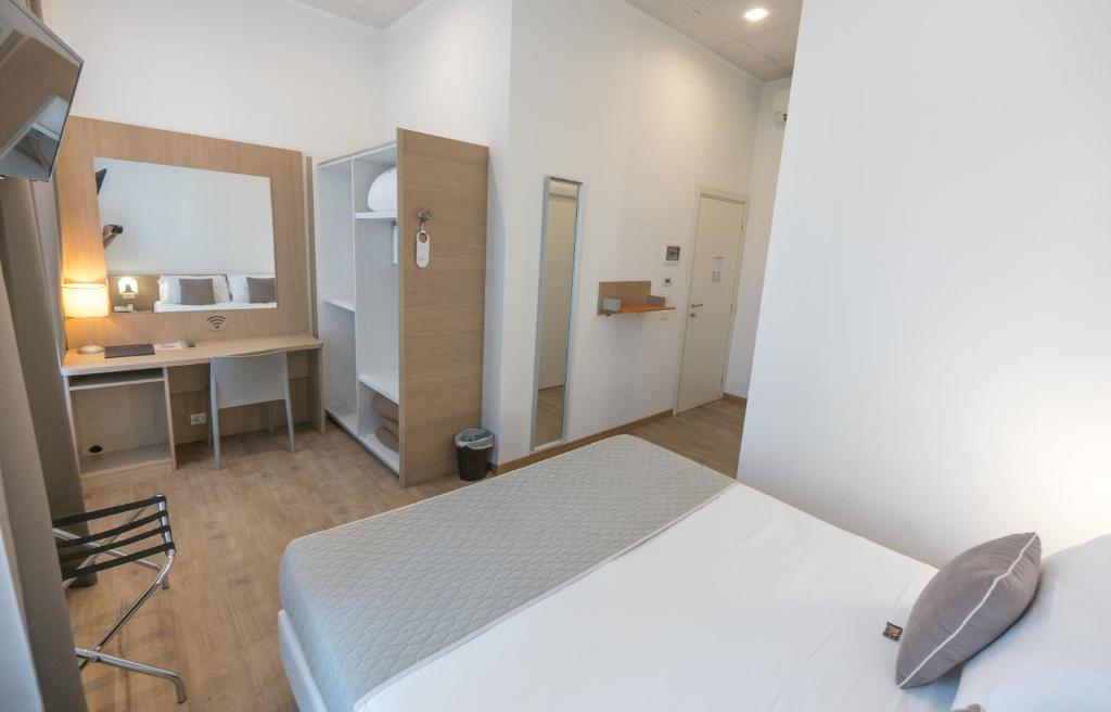 Posteľ alebo postele v izbe v ubytovaní Nuovo Albergo Centro