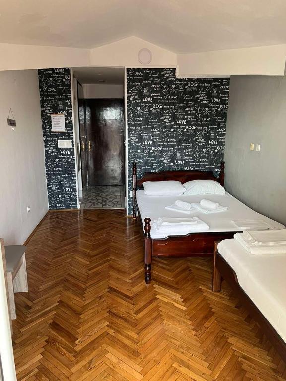 Postel nebo postele na pokoji v ubytování Guesthouse Vila Tamburic