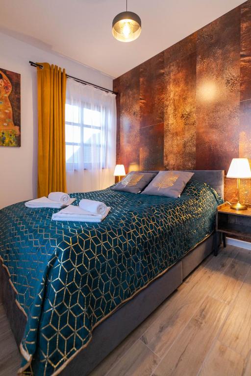 Posteľ alebo postele v izbe v ubytovaní Apartament Liściasty 1 z tarasem - Dream Apart