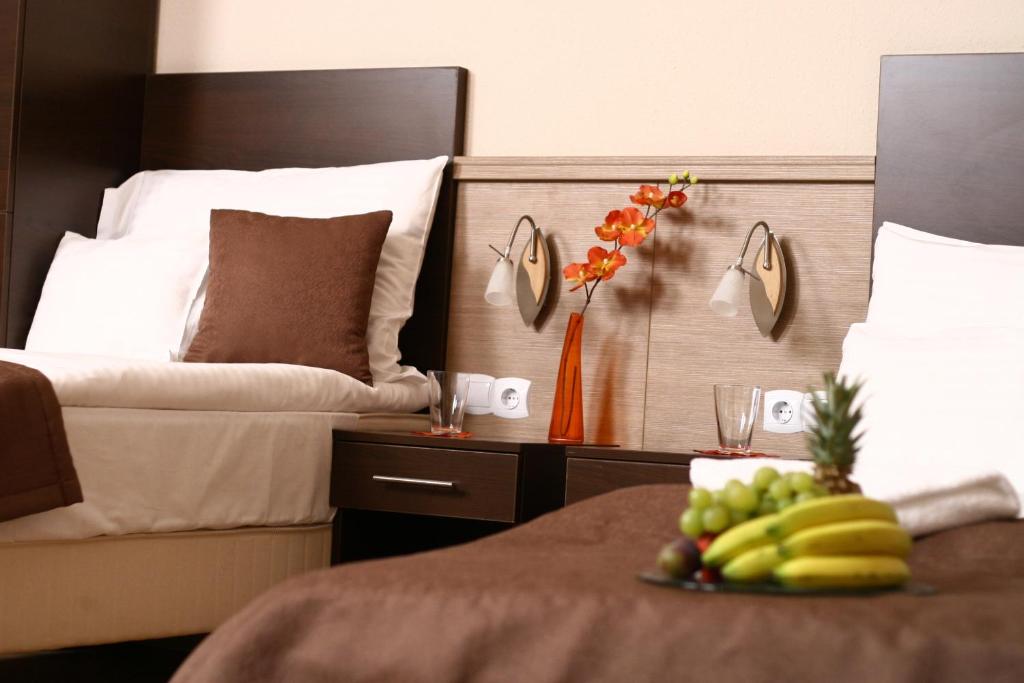 Postel nebo postele na pokoji v ubytování Central Hotel 21 and Apartments