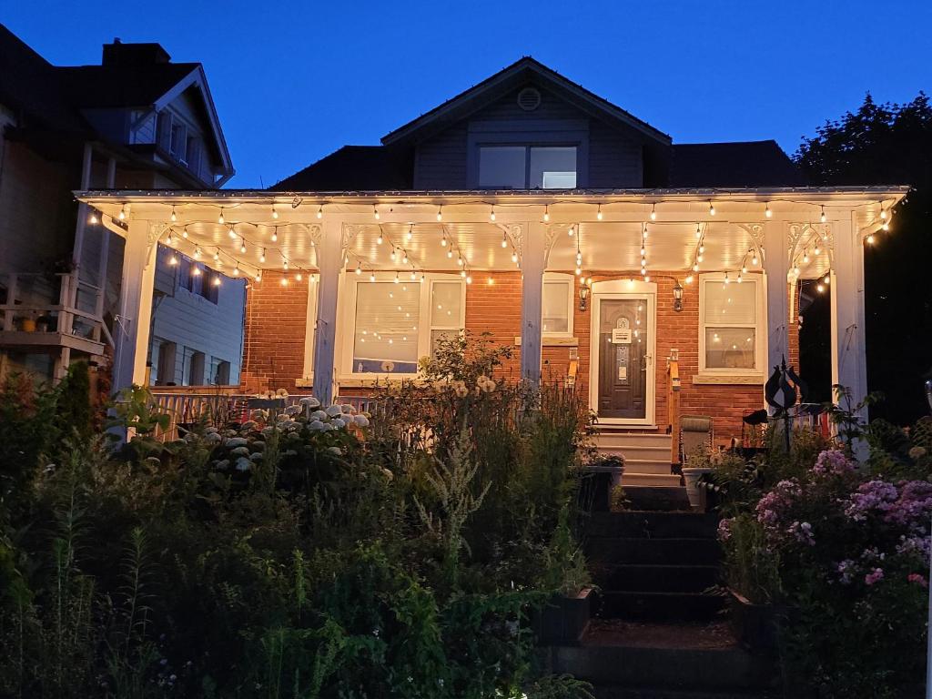 a house with christmas lights on the front of it at Serene Niagara Inn in Niagara Falls
