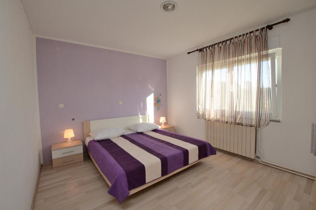 Łóżko lub łóżka w pokoju w obiekcie Villa Mirka