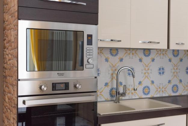 A kitchen or kitchenette at TOLEDO HOME 116