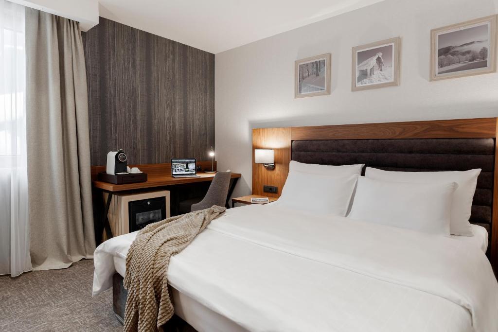 Postel nebo postele na pokoji v ubytování Hotel Grand Kopaonik