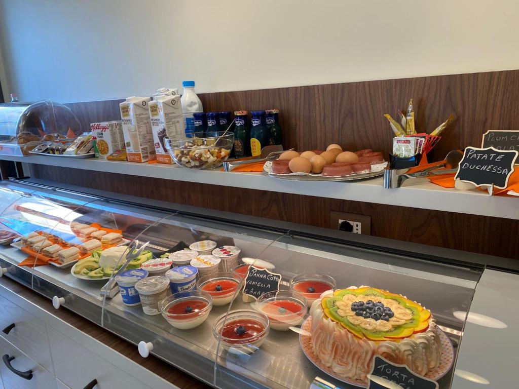 a buffet line with food on display in a restaurant at Solmaris Tropea Rooms & Suites in Tropea