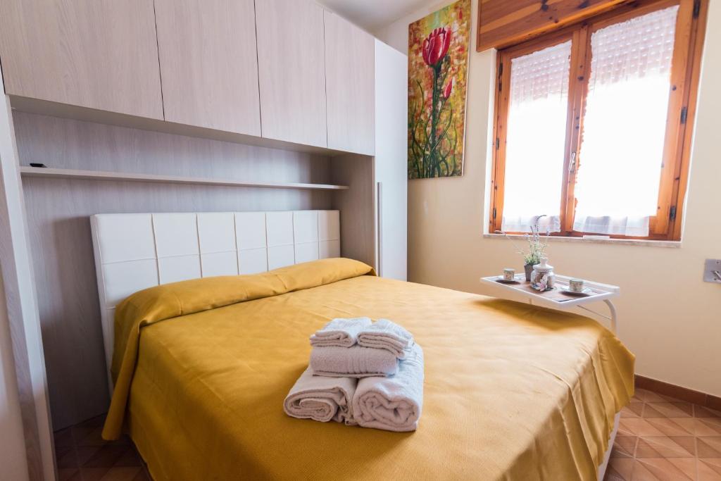 מיטה או מיטות בחדר ב-Gallipoli via Dante