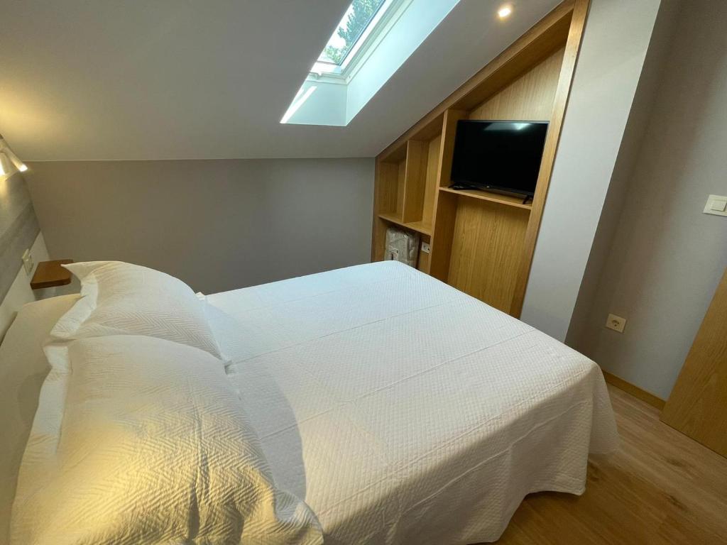 Postel nebo postele na pokoji v ubytování Casa y Apartamento Rural Terra Celta en Salceda de Caselas