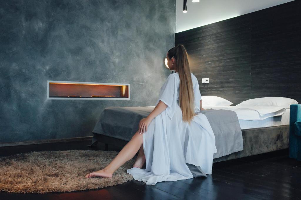 Postel nebo postele na pokoji v ubytování Arkadia Beach Hotel