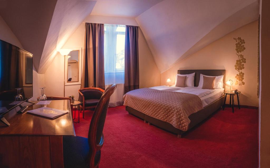 Postel nebo postele na pokoji v ubytování Grand Hotel Bellevue - adults only