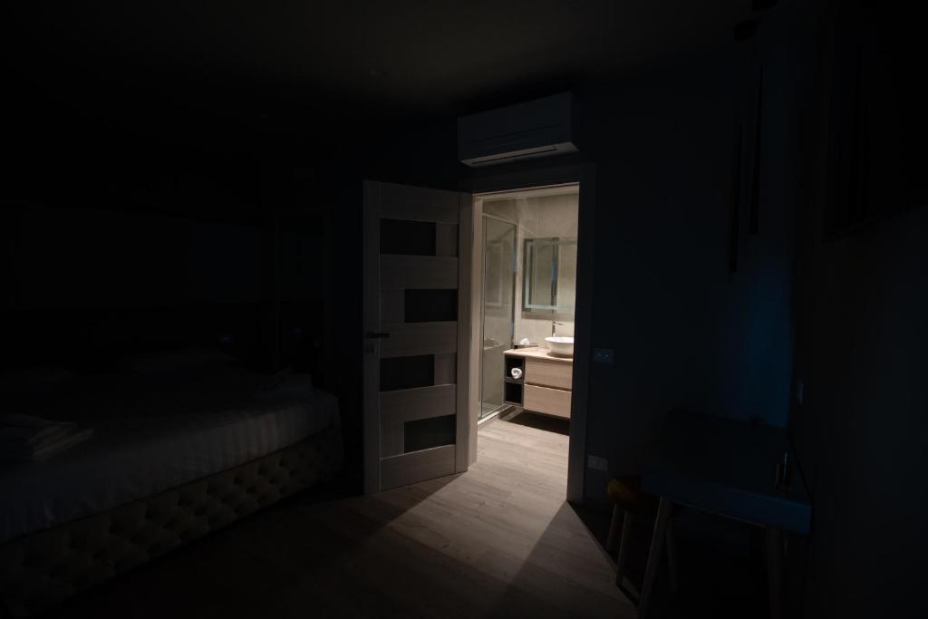 Postel nebo postele na pokoji v ubytování DiVino Rooms Deluxe