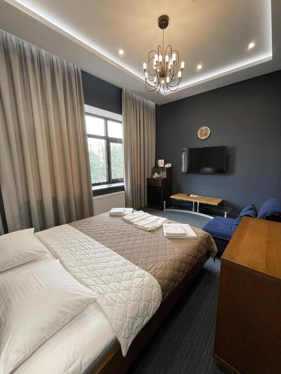 Postel nebo postele na pokoji v ubytování Levanevsky Hotel