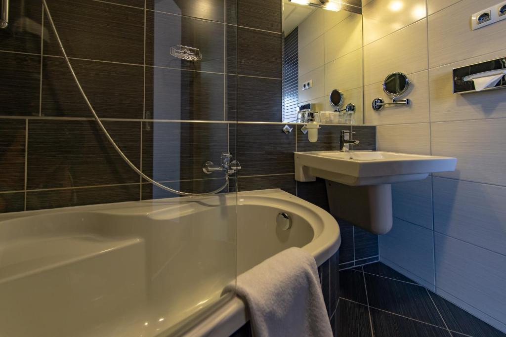 Koupelna v ubytování Hotel Regnum Residence