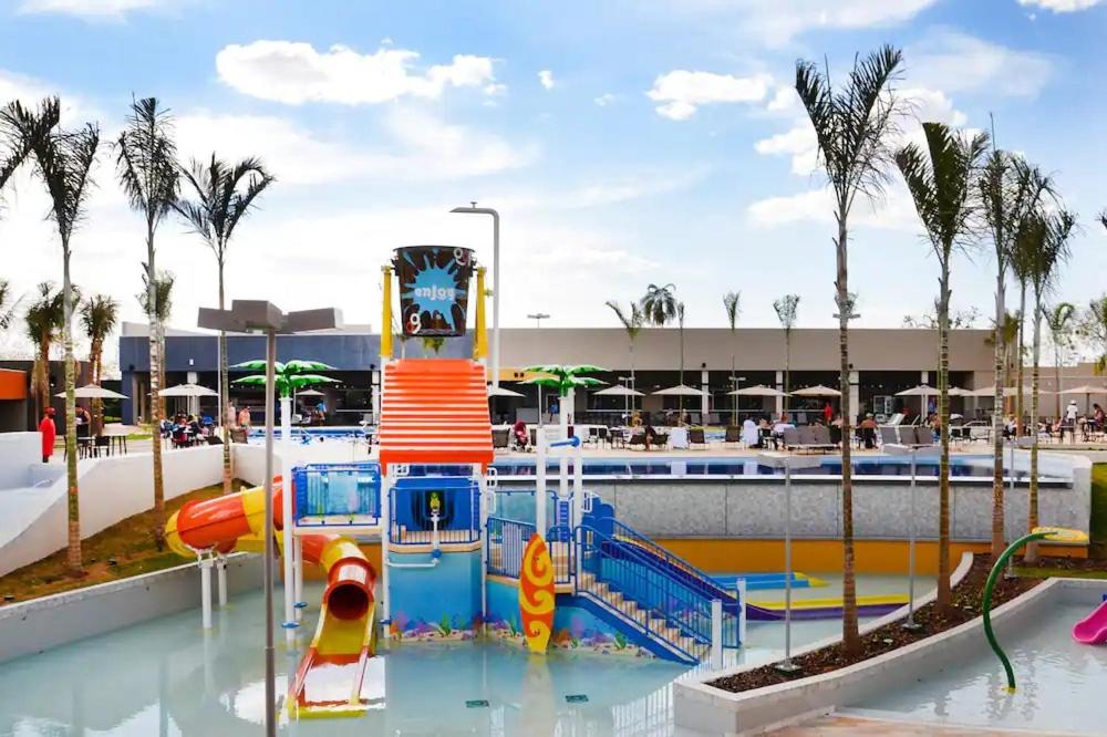 a water park with a roller coaster in the water at APARTAMENTO OLIMPIA SOLAR DAS AGUAS in Olímpia