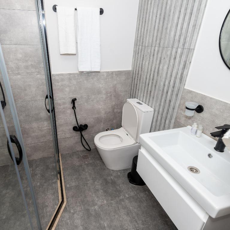 Koupelna v ubytování OLF Hotel
