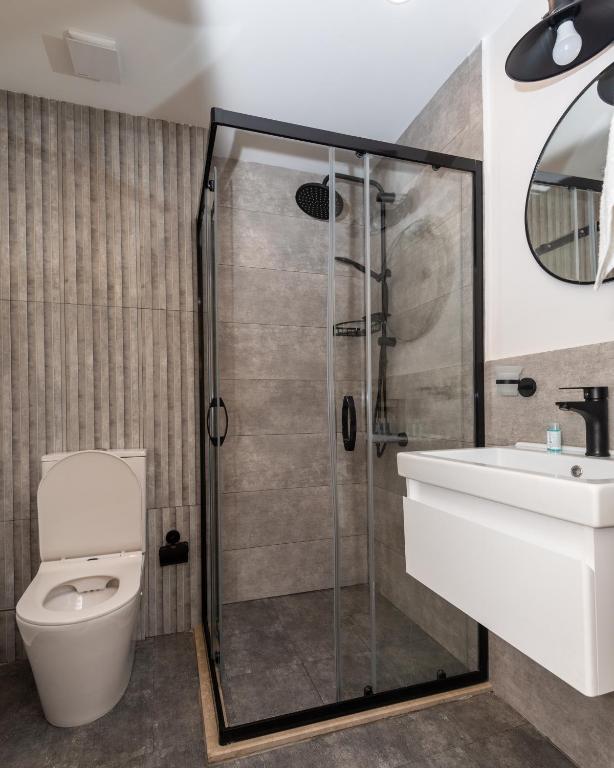 Koupelna v ubytování OLF Hotel