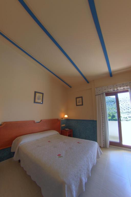 Postel nebo postele na pokoji v ubytování Hotel Avenida