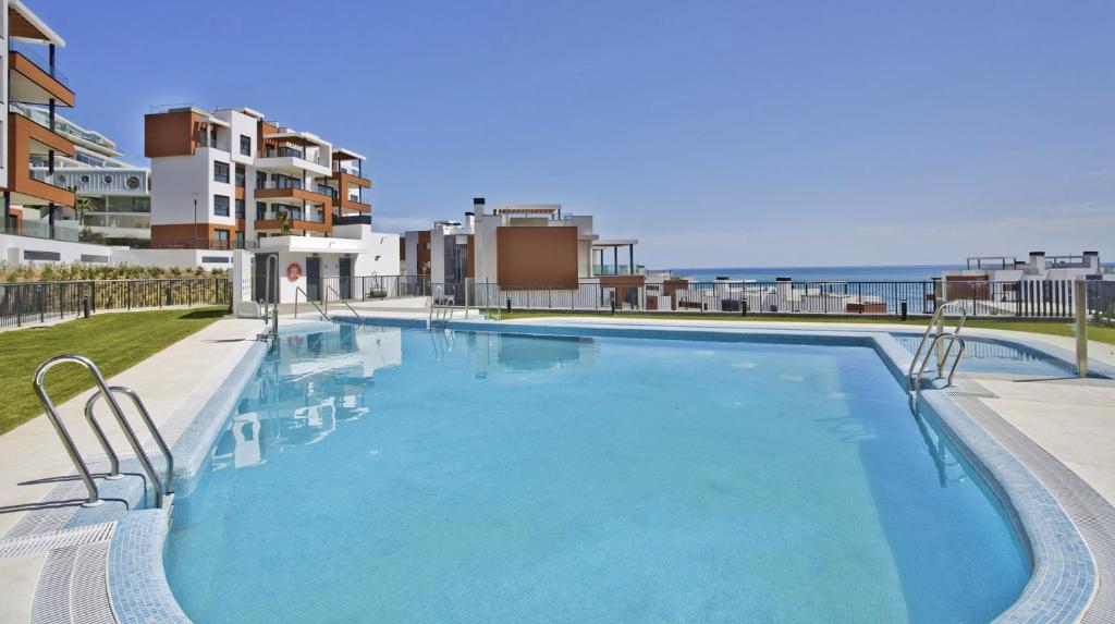 a large swimming pool on top of a building at Modern Apartment-Sea View in Fuengirola