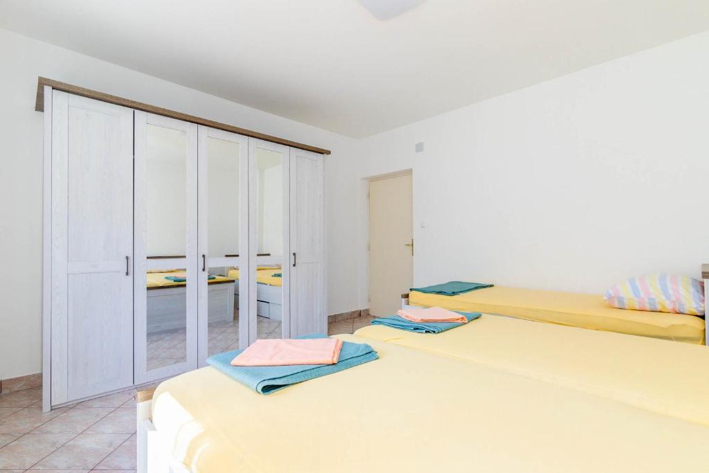 Postel nebo postele na pokoji v ubytování Apartment Lea
