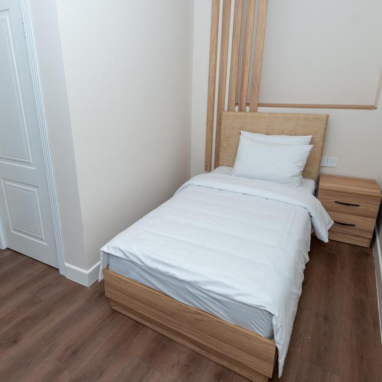 Postel nebo postele na pokoji v ubytování OLF Hotel
