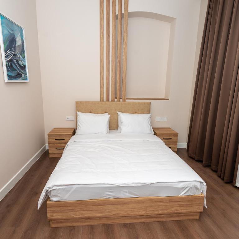 Postel nebo postele na pokoji v ubytování OLF Hotel