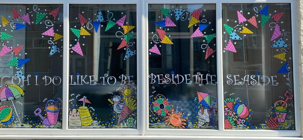 a window with a bunch of kites on it at The Hurstmere in Blackpool