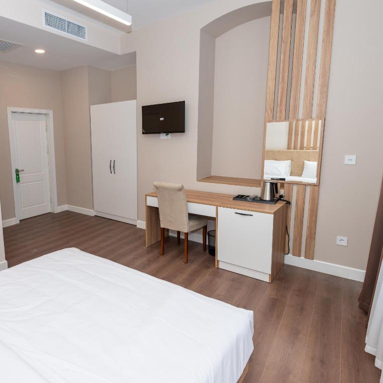 TV a/nebo společenská místnost v ubytování OLF Hotel