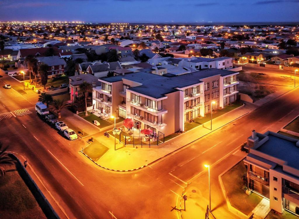 una vista aérea de una ciudad por la noche en Flamingo Villas Boutique Hotel, en Walvis Bay