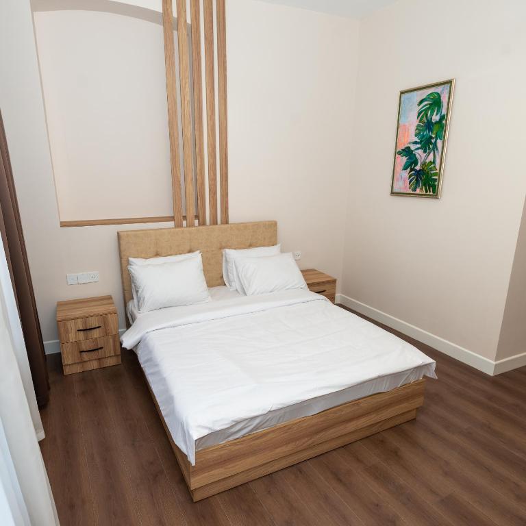 Postel nebo postele na pokoji v ubytování OLF Hotel