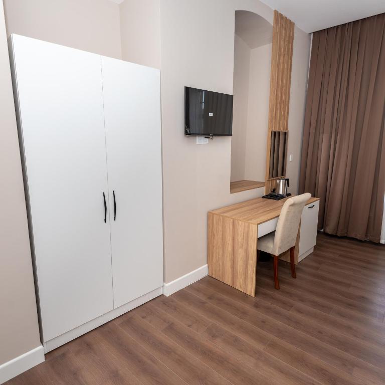 TV a/nebo společenská místnost v ubytování OLF Hotel