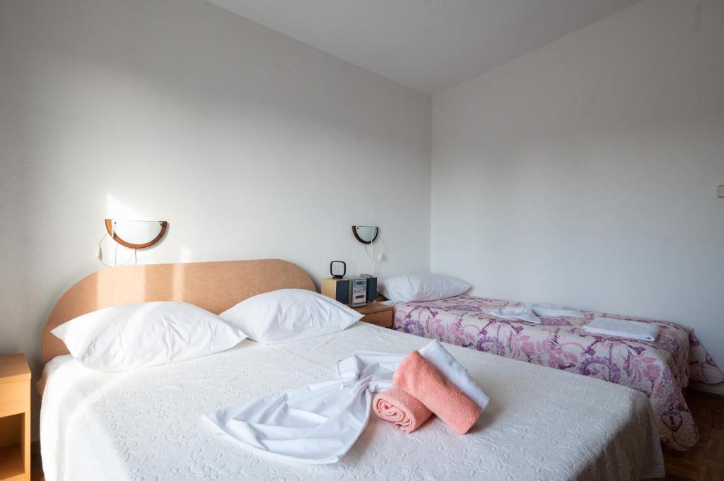 Posteľ alebo postele v izbe v ubytovaní Marina's Apartments