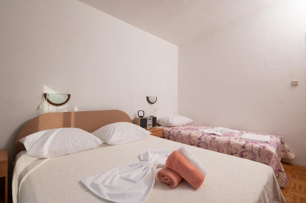 Posteľ alebo postele v izbe v ubytovaní Marina's Apartments