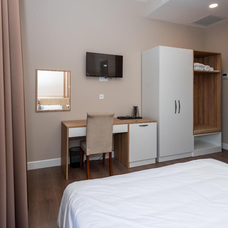 Kuchyň nebo kuchyňský kout v ubytování OLF Hotel