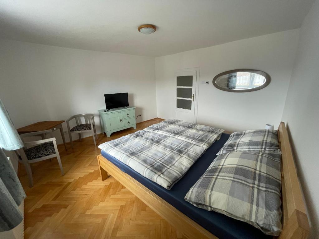 Postel nebo postele na pokoji v ubytování Apartmán Počátky