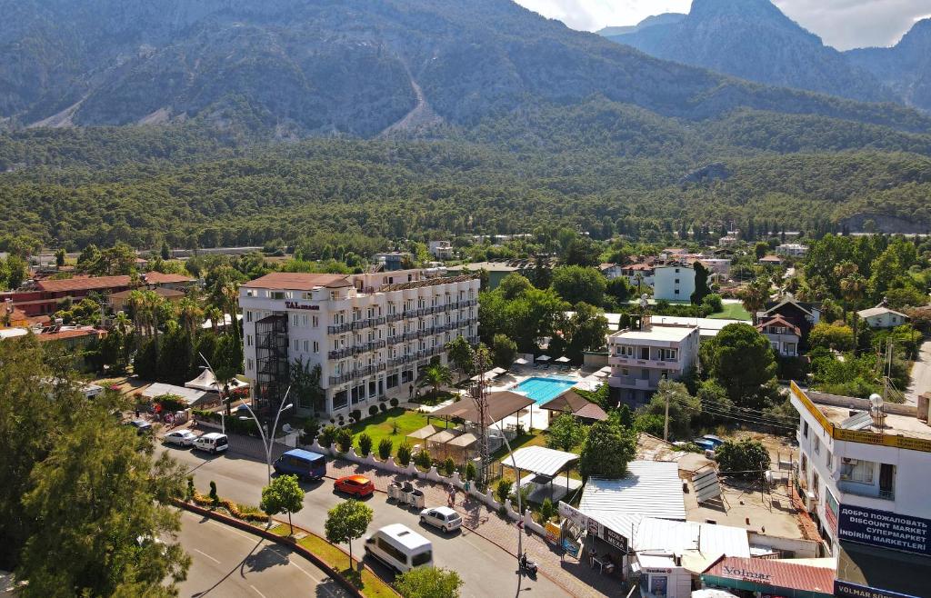 an aerial view of a city with mountains in the background at Tal Beach Hotel in Beldibi