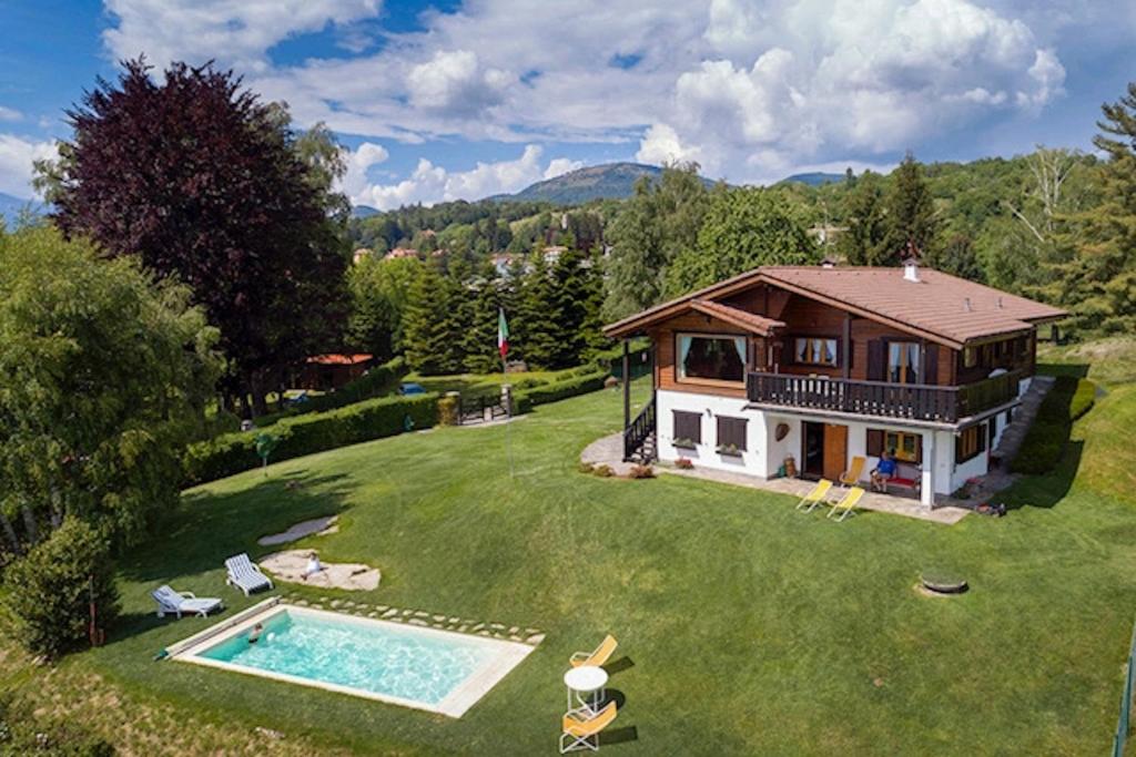 an aerial view of a house with a swimming pool at Villa Tirolese in Due Cossani