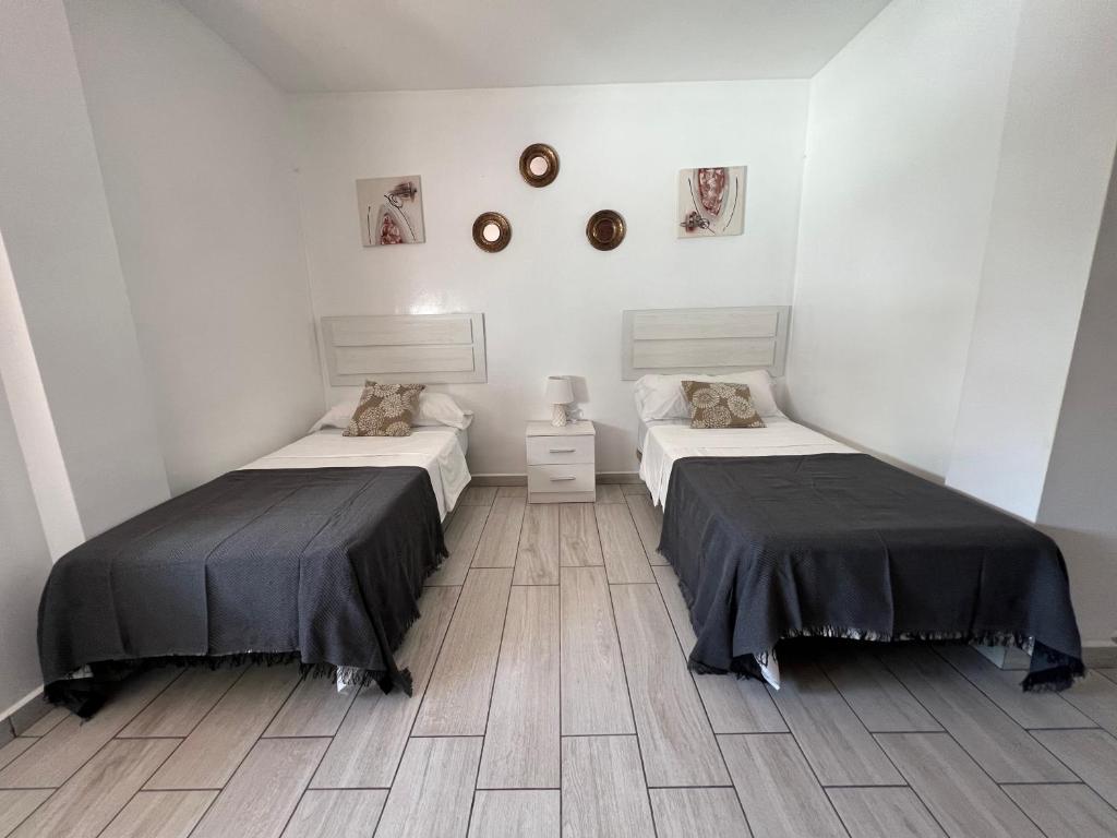 Posteľ alebo postele v izbe v ubytovaní MI CASA