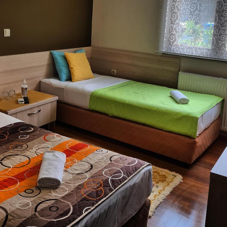 Postel nebo postele na pokoji v ubytování Hotel Bulevar