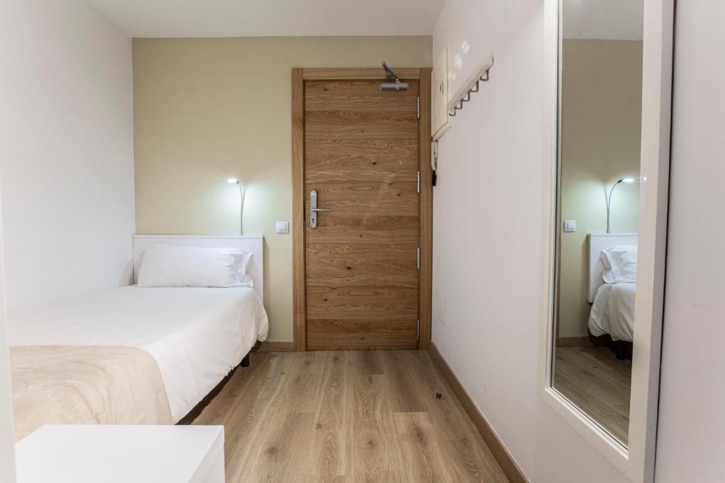 Postel nebo postele na pokoji v ubytování Outdoor Apartaments - Basecamp