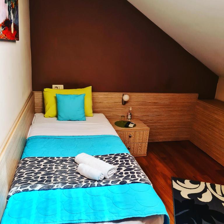 Postel nebo postele na pokoji v ubytování Hotel Bulevar
