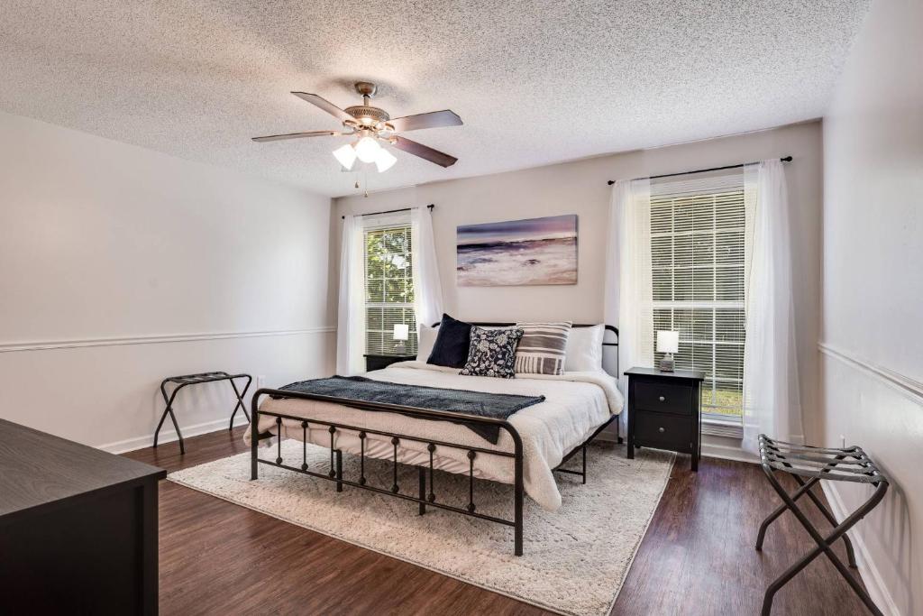 a bedroom with a bed and a ceiling fan at Bermuda Drive Abode in Fleming Island