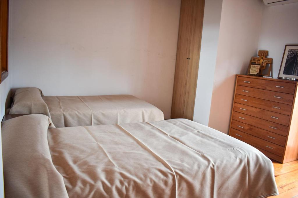 A bed or beds in a room at Salvadora Luminosa