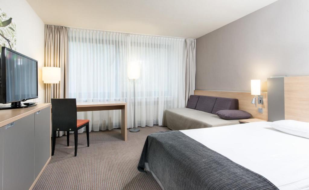 Postel nebo postele na pokoji v ubytování Mercure Hotel Düsseldorf Neuss